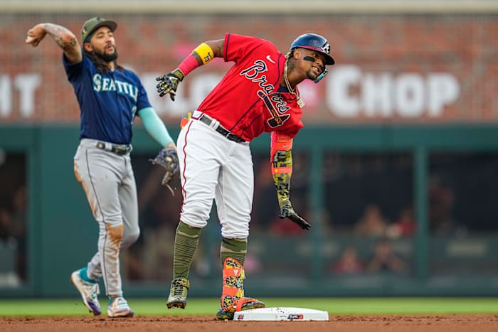 May 19, 2023; Cumberland, Georgia, USA; Atlanta Braves right fielder Ronald Acuna Jr. (13) reacts after hitting a double against the Seattle Mariners during the first inning at Truist Park.